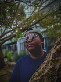 Portrait of young man wearing sunglasses