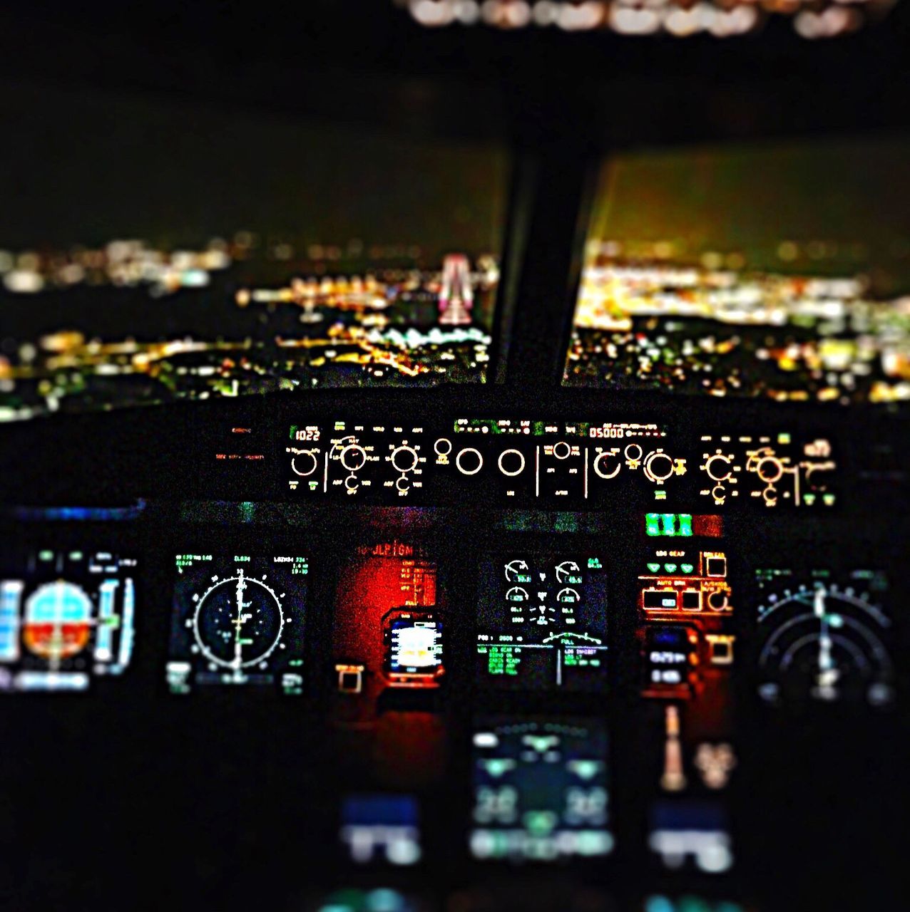 technology, control, air vehicle, close-up, electronics industry, complexity, circuit board, no people, cockpit, airplane, indoors, control panel, illuminated, aerospace industry, gauge, night