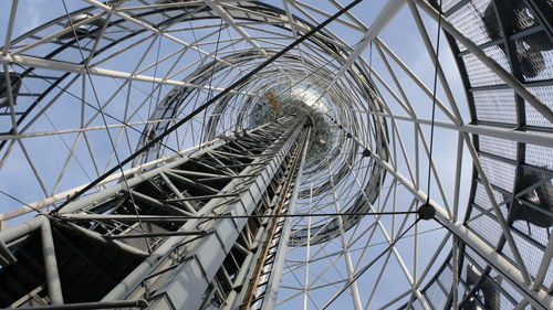 Low angle view of metallic structure against sky