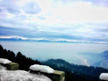 Scenic view of mountains against sky during winter