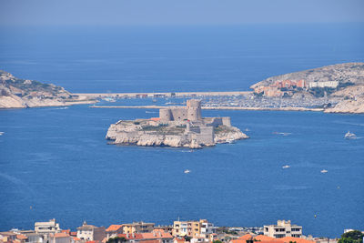 High angle view of townscape by sea