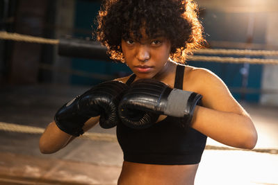 Young woman exercising in gym