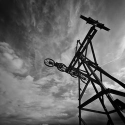 Silhouette of derelict gantries with dramatic sky