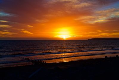 Scenic view of sea against sky during sunset