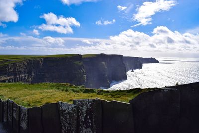 Scenic view of landscape against cloudy sky