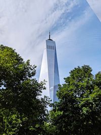 Low angle view of building against cloudy sky