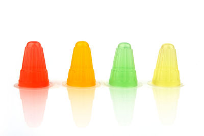 Close-up of multi colored pencils against white background