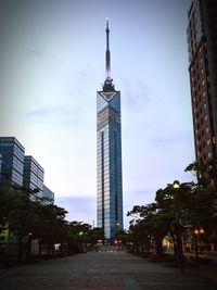 Low angle view of buildings in city against sky