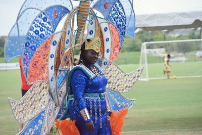 Portrait of woman wearing costume at soccer field