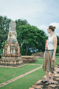 Woman standing at temple