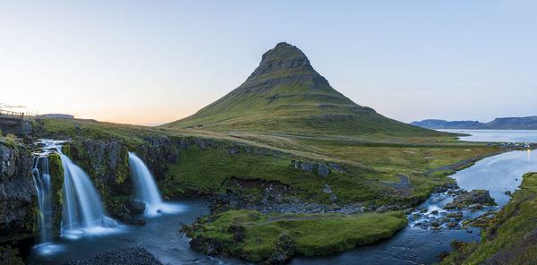 Scenic view of waterfall against sky