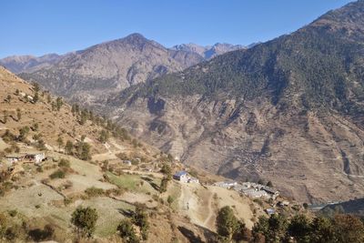 High angle view of mountains against clear blue sky