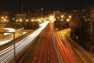 High angle view of light trails on city street at night