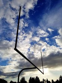 Low angle view of silhouette street light against sky