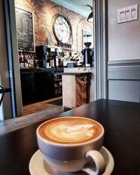 Close-up of coffee served on table