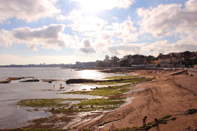 Panoramic view of beach against sky in city