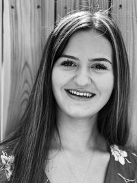 Close-up portrait of smiling young woman