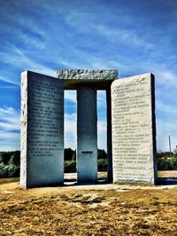 Built structure by sea against sky