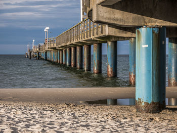 Pier over sea against sky