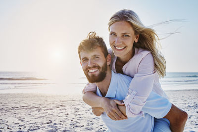 Portrait of happy couple on the beach