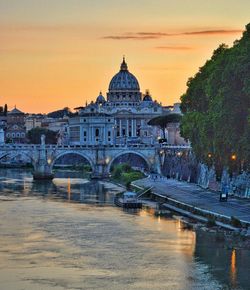 View of bridge over river at sunset