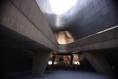 People in illuminated building