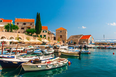 Boats moored at harbor