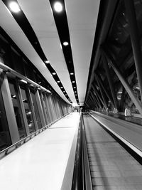 Low angle view of illuminated bridge at night