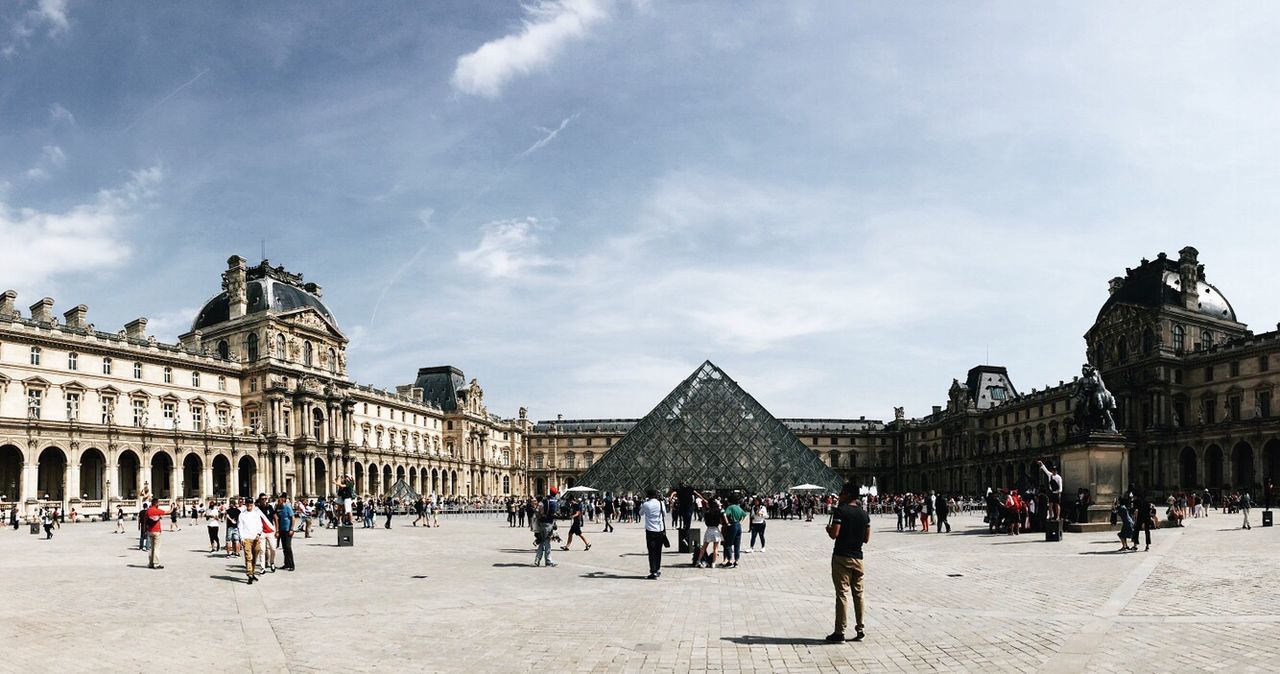 large group of people, built structure, architecture, building exterior, travel destinations, history, sky, tourism, day, real people, cloud - sky, travel, leisure activity, lifestyles, men, mixed age range, sculpture, city life, statue, women, outdoors, vacations, ancient civilization, people, adult