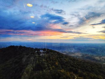 Scenic view of mountains against sky during sunset