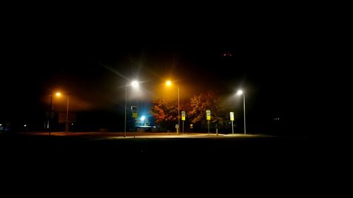 View of illuminated street light at night