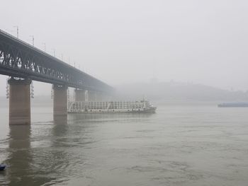 Bridge over sea against sky