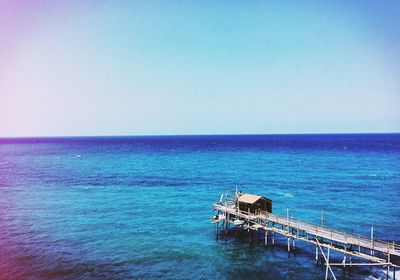 High angle view of pier over calm blue sea