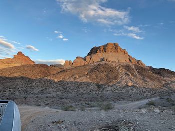 Rock formations in desert against sky