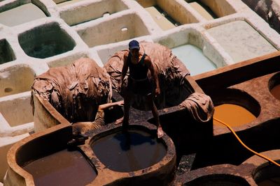 High angle view of woman standing by water