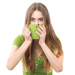 Portrait of a young woman drinking glass