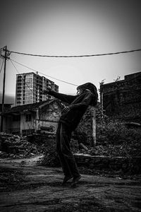 Side view of abandoned building against sky