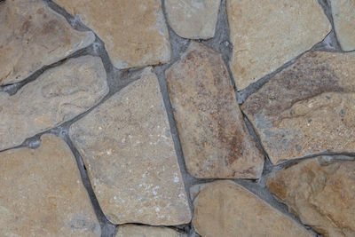 High angle view of stones on tiled floor