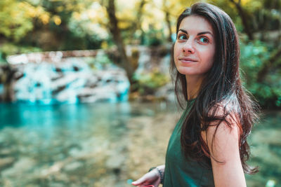 Portrait of beautiful young woman outdoors