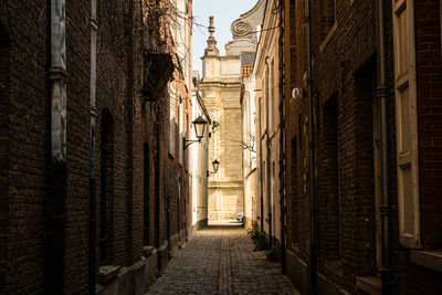 Alley amidst buildings in city