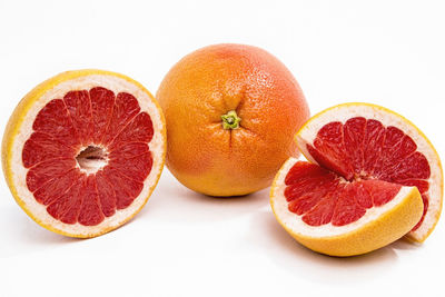 Close-up of oranges against white background