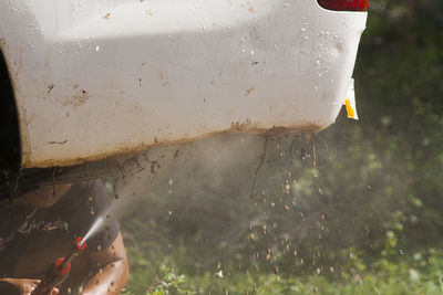 Close-up of water drops on glass of car