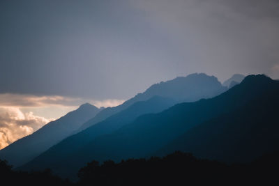 Scenic view of mountains against clear blue sky
