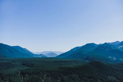 Scenic view of mountains against clear blue sky