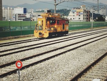 Train on railroad track in city