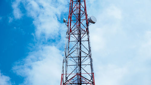 Low angle view of communications tower against sky