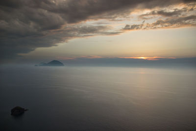 Scenic view of sea against sky at sunset