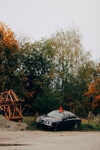 Car on field against sky