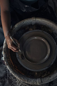 Cropped hand of potter making pottery