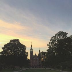 Silhouette of castle against sky at sunset